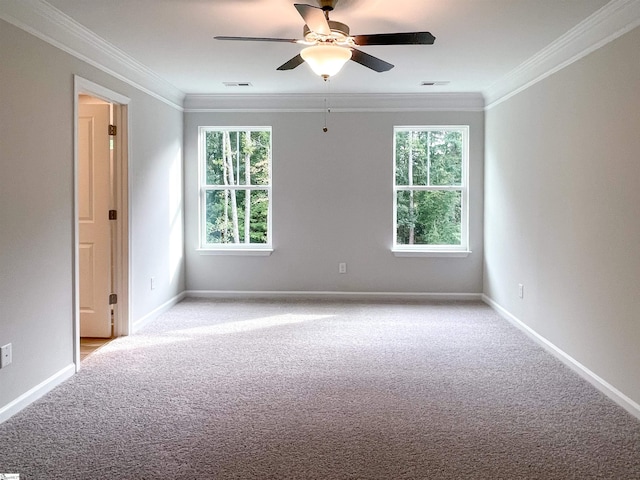 spare room featuring visible vents, baseboards, light carpet, and crown molding