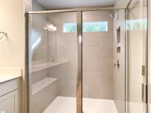 full bathroom featuring vanity and a stall shower