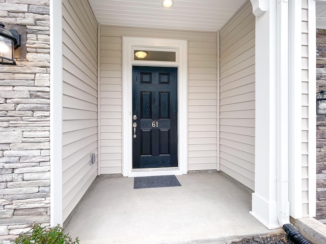 view of exterior entry with stone siding