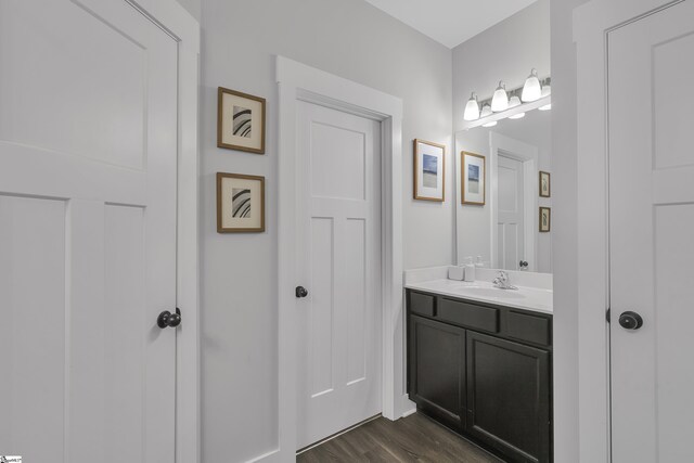 bathroom featuring vanity and hardwood / wood-style floors