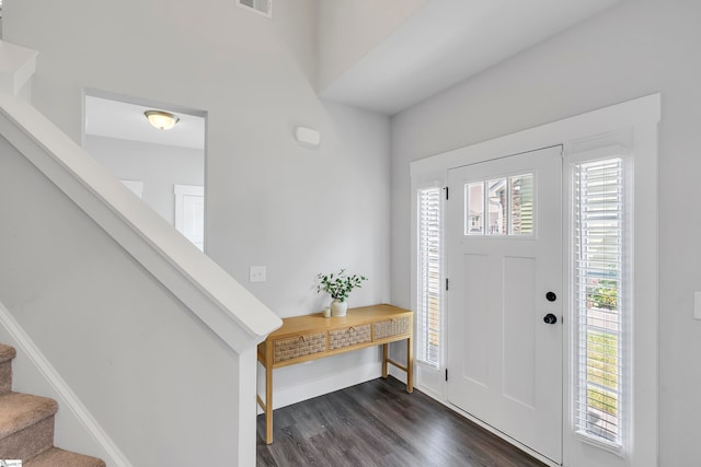 entryway with dark hardwood / wood-style flooring