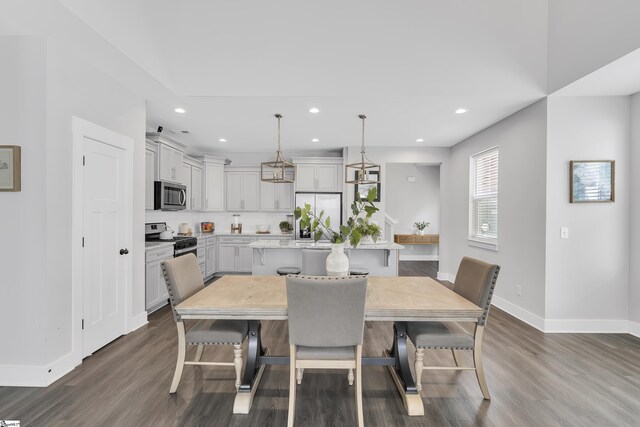 dining area featuring wood-type flooring