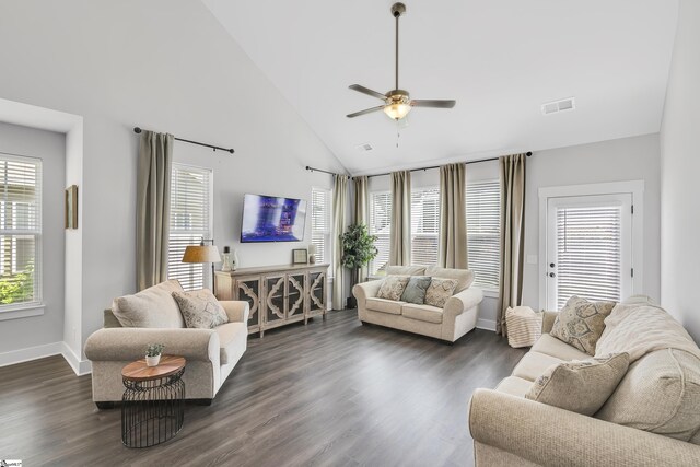 living room featuring ceiling fan, high vaulted ceiling, and dark wood-type flooring