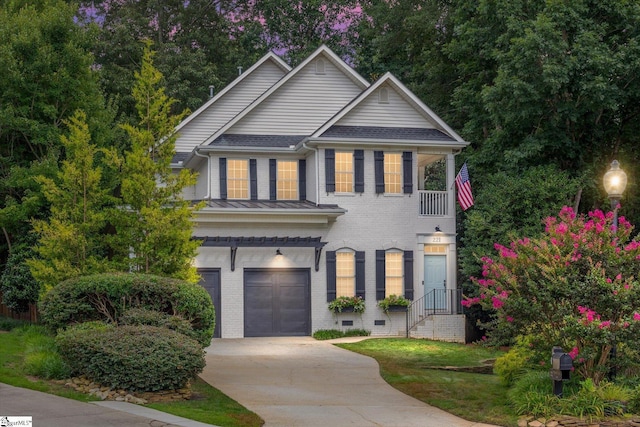 view of front of home featuring brick siding, an attached garage, and driveway