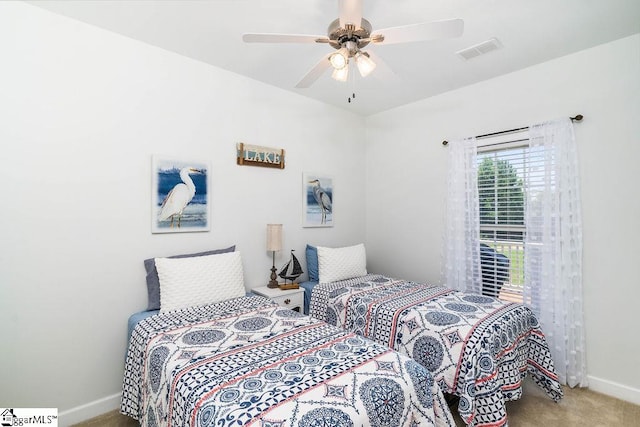 carpeted bedroom featuring ceiling fan