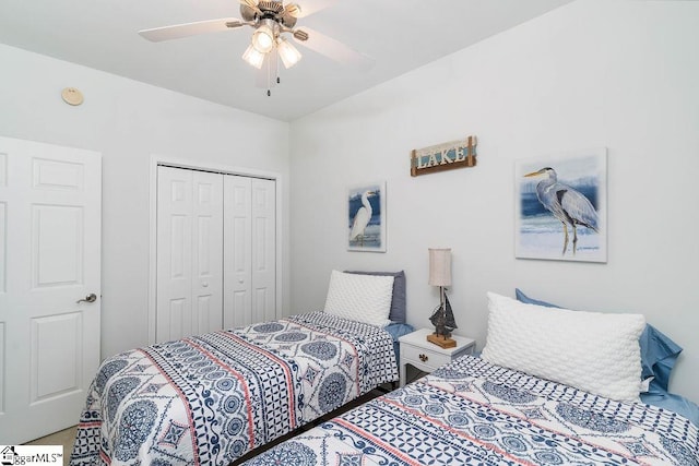 bedroom with ceiling fan and a closet