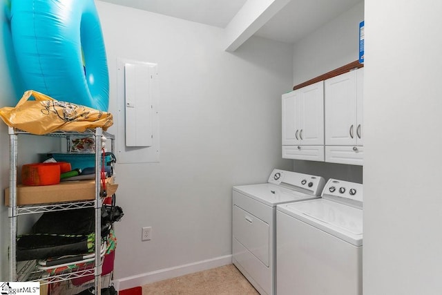 laundry area with cabinets, light tile patterned flooring, electric panel, and independent washer and dryer