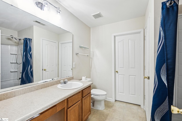 bathroom with curtained shower, vanity, and visible vents