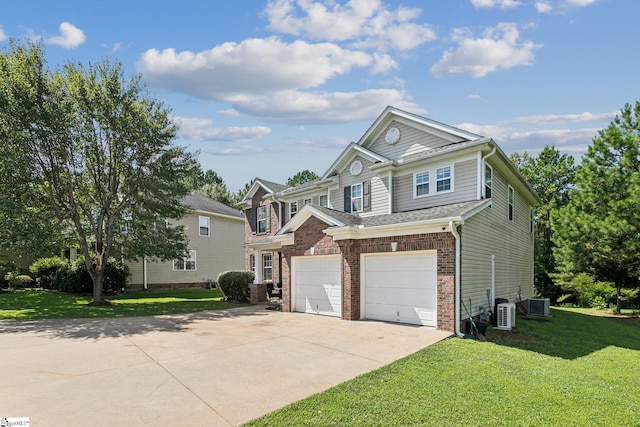 view of front of home featuring central air condition unit, a front yard, and a garage