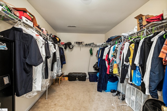 spacious closet featuring carpet floors and visible vents