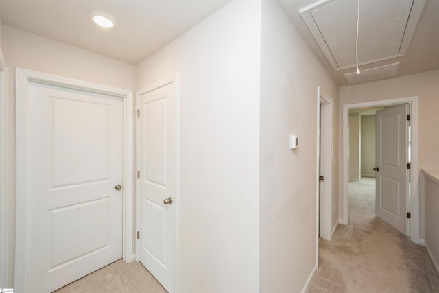 corridor with light colored carpet