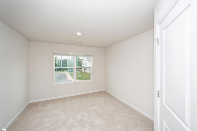 empty room with light colored carpet