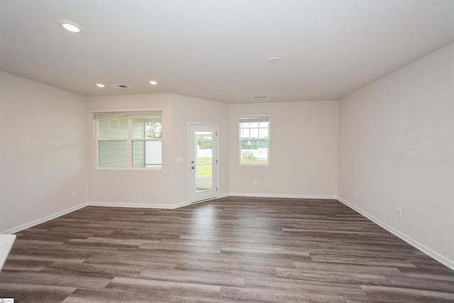 spare room featuring hardwood / wood-style flooring