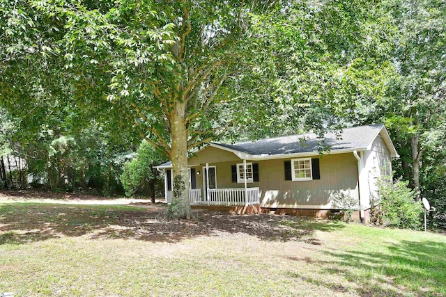 view of front of home with a porch and a front lawn