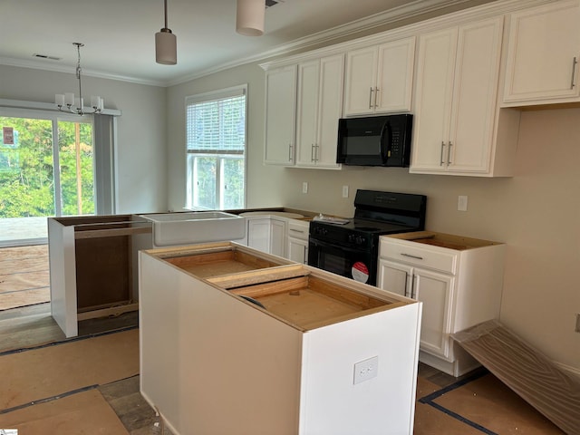 kitchen featuring a center island, black appliances, crown molding, hanging light fixtures, and white cabinetry