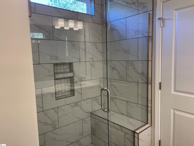 full bath with a shower stall