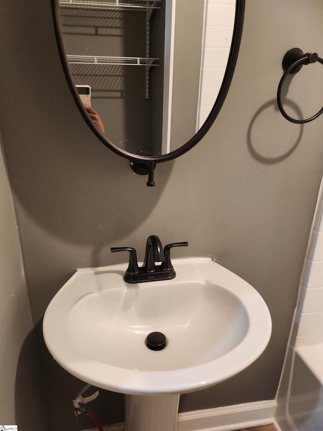 bathroom featuring a tub and a sink