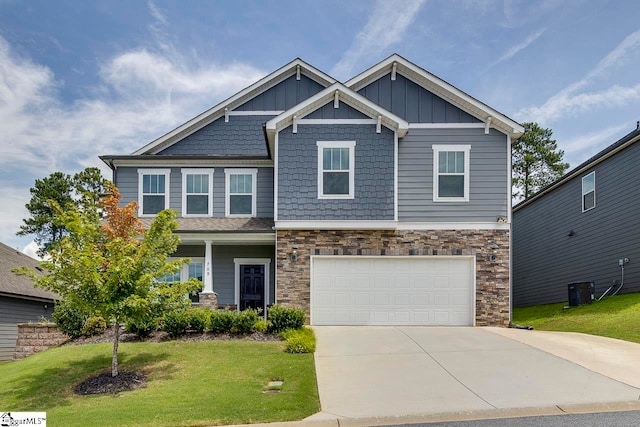 craftsman-style house with a garage and a front yard