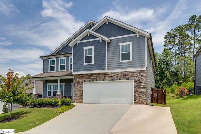 craftsman-style home with a garage and a front yard