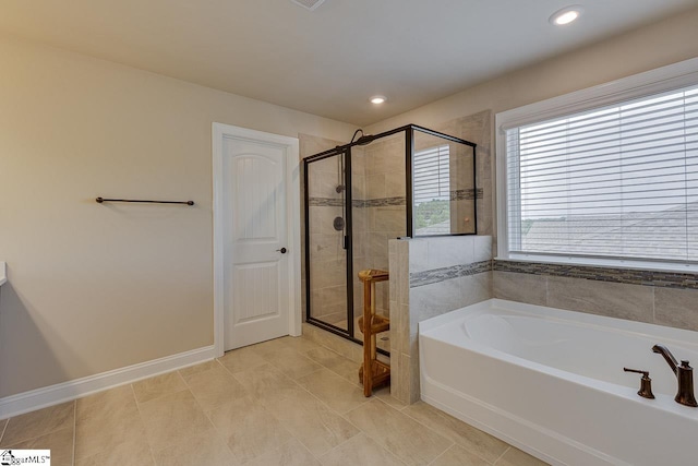 full bathroom with a stall shower, recessed lighting, a garden tub, and baseboards