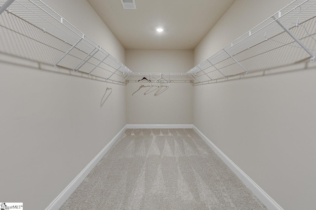 walk in closet featuring carpet and visible vents