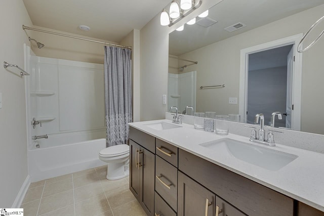 full bath featuring toilet, a sink, visible vents, and tile patterned floors