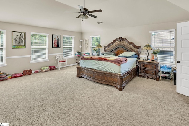 bedroom featuring vaulted ceiling, light colored carpet, and ceiling fan