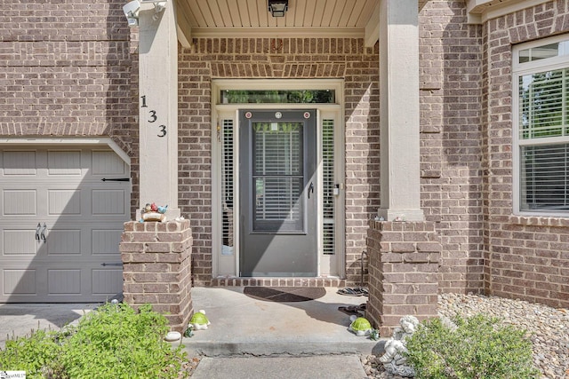 property entrance with a garage