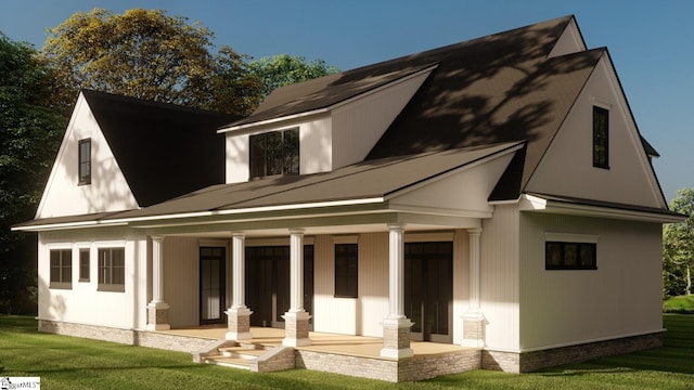 rear view of house featuring a yard and covered porch