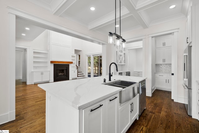 1 Mapleton Dr, Greenville, SC 29607 - kitchen featuring a sink, appliances with stainless steel finishes, white cabinets, an island with sink, and light stone countertops