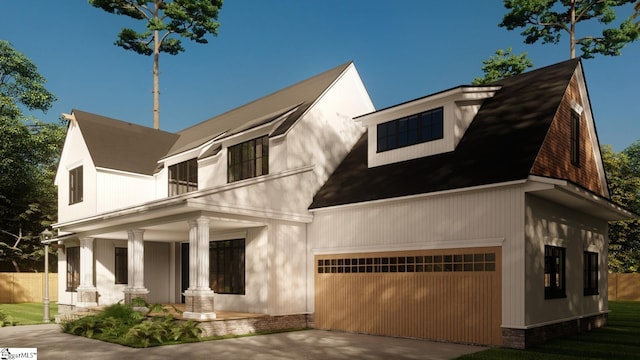 view of front of house with a garage and covered porch