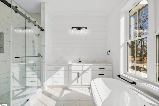 bathroom featuring vanity and separate shower and tub