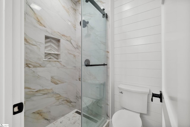 bathroom with walk in shower and toilet