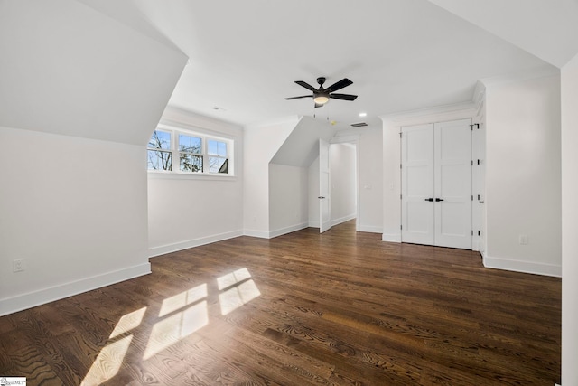 additional living space featuring ceiling fan, dark hardwood / wood-style floors, and vaulted ceiling