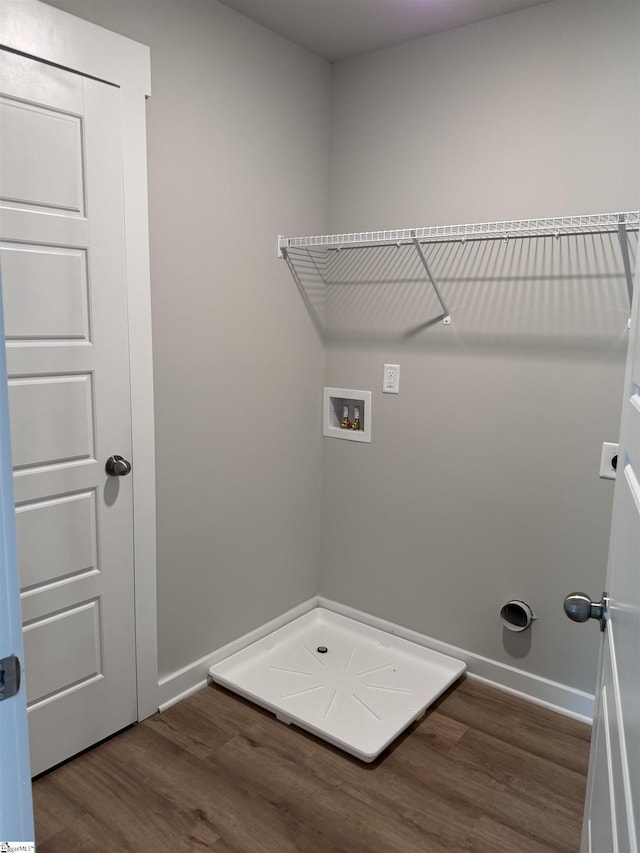 laundry room featuring hardwood / wood-style flooring and washer hookup