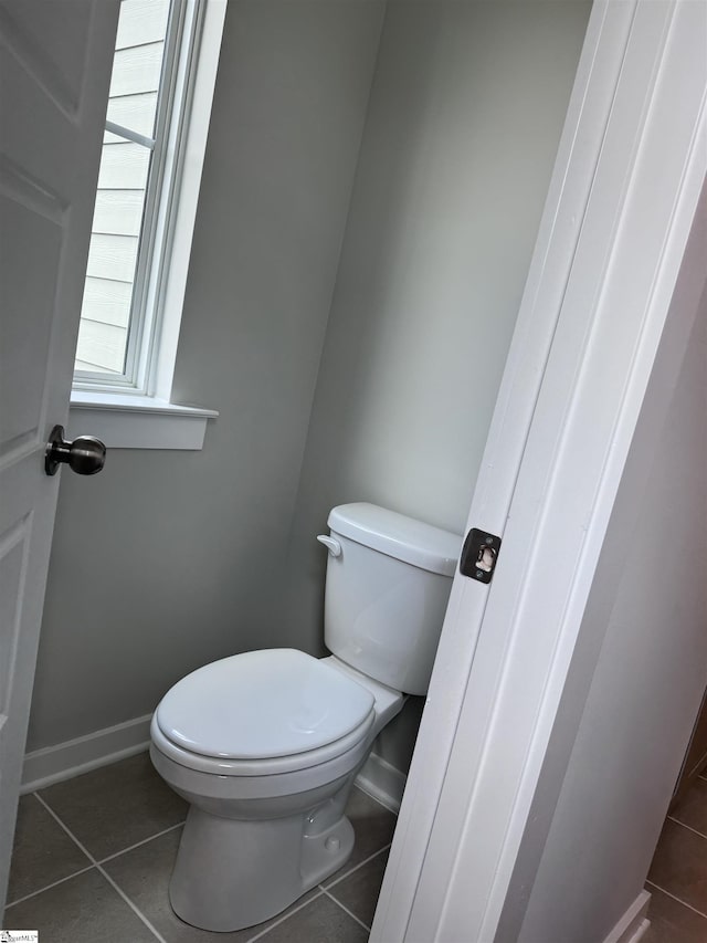 bathroom with tile patterned flooring and toilet