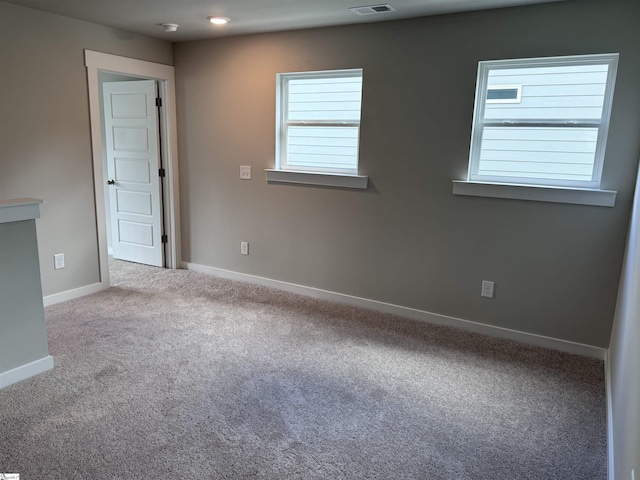 unfurnished room with carpet flooring