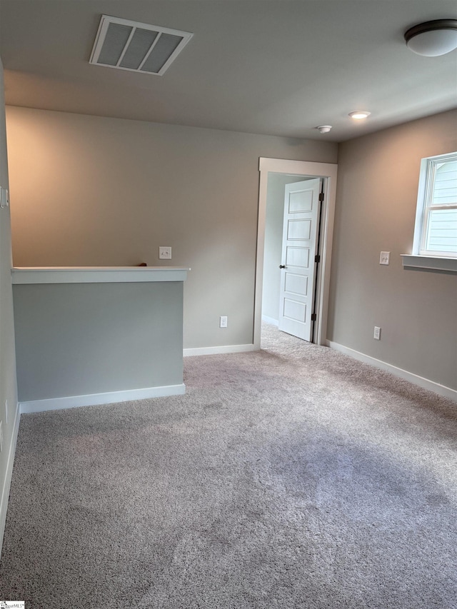 unfurnished room with carpet flooring