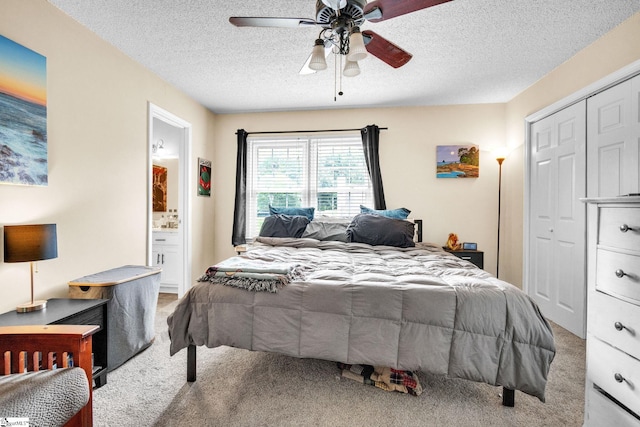 bedroom with carpet floors, a textured ceiling, and ceiling fan