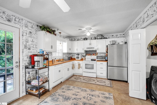 kitchen featuring light tile patterned floors, a wealth of natural light, ceiling fan, and stainless steel appliances