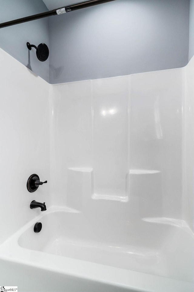 full bath featuring washtub / shower combination