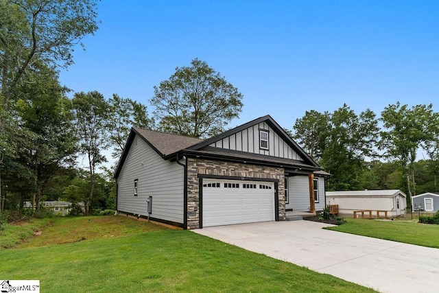 view of front of property featuring stone siding, a front lawn, board and batten siding, and concrete driveway