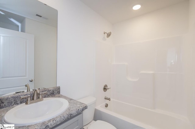 full bathroom featuring vanity, toilet, and shower / washtub combination