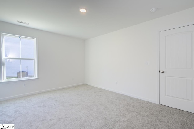 spare room with carpet floors