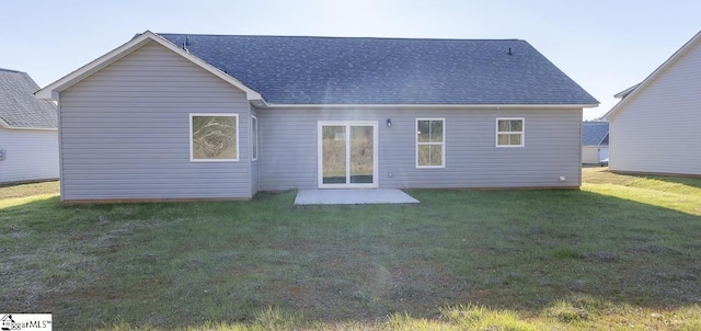 rear view of property with a patio area and a yard