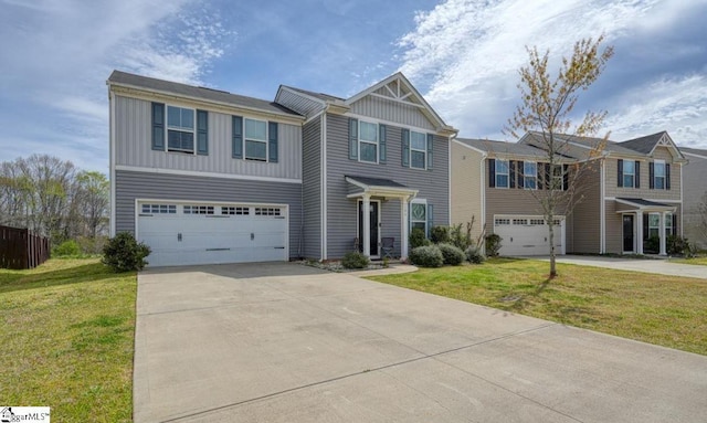 view of front of property with board and batten siding, a front yard, driveway, and a garage