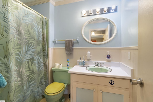 bathroom with vanity, ornamental molding, and toilet