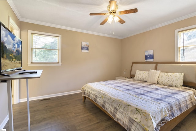 bedroom featuring ornamental molding, dark hardwood / wood-style flooring, and multiple windows