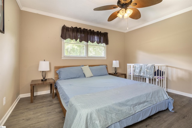 bedroom featuring crown molding, ceiling fan, and dark hardwood / wood-style flooring