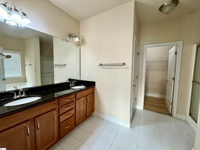 bathroom featuring separate shower and tub, tile patterned flooring, and dual bowl vanity